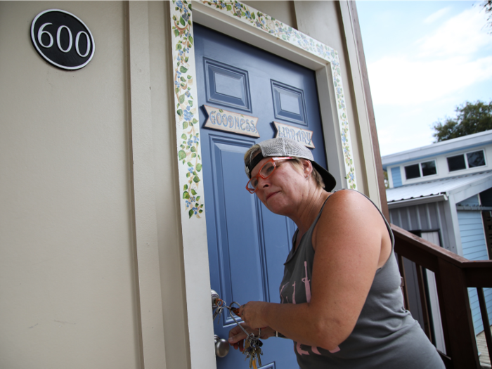 She works in the community, spends time with her neighbors, and every other weekend, she visits her partner of 13 years in jail.