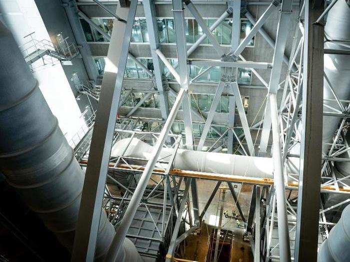 A glass elevator allows visitors to peer inside the plant.