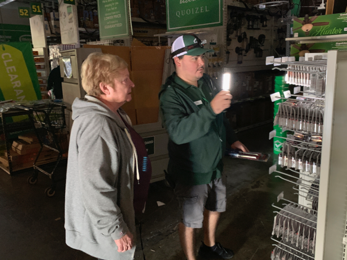 After the power was cut, Californians were still shopping at hardware stores to stock up on batteries, flashlights, coolers, or oil lamps, guided by employees wielding flashlights or headlamps.