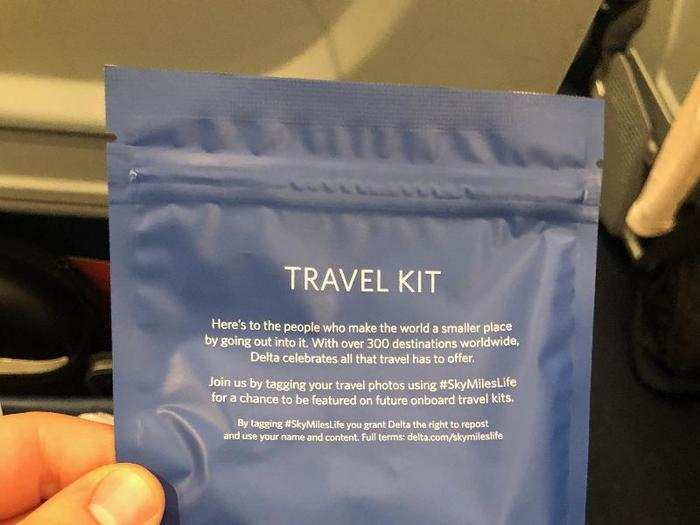 Flight attendants also distributed small amenity kits with a sleep mask, earplugs, and a cleaning wipe.