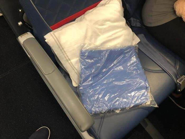 Each passenger got a small pillow and blanket, which was waiting on the seat.