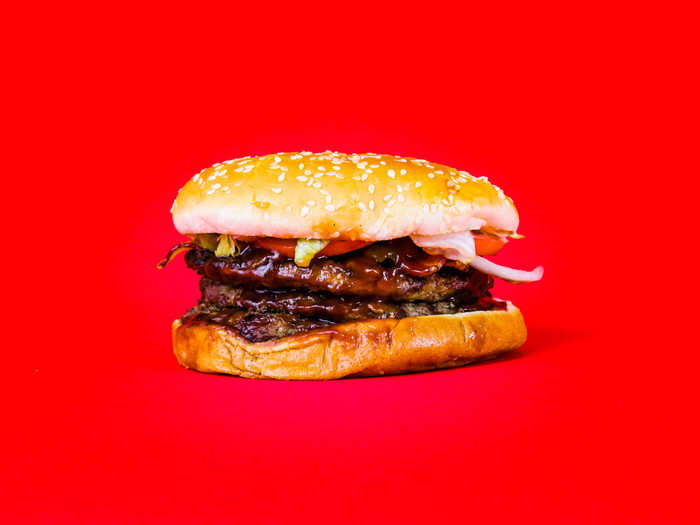 The BBQ Bacon Triple Whopper should contain three quarter-pound patties, smoked bacon, American cheese, lettuce, mayo, tomatoes, ketchup onions, pickles, and BBQ sauce on a toasted sesame seed bun.