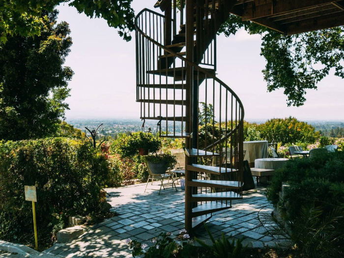 It has a lower level patio, with spiral staircase access to the treehouse.