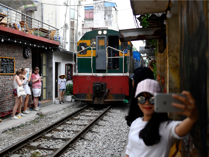 “There have never been any regretful accidents here,” local cafe owner Le Tuan Anh told The Guardian. He runs his shop from his home next to the tracks.