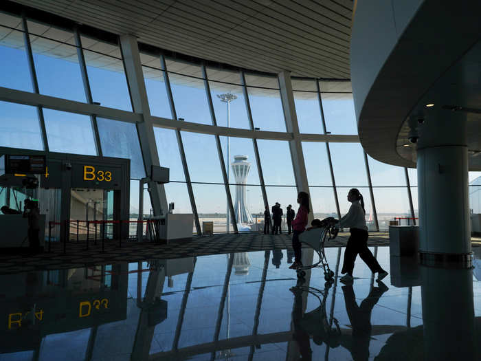 After a bit more exploring, I realized I had to go to my gate — perhaps I was too busy taking photos to hear the boarding announcement! I left the airport in awe of its impressive design and heartened by how proud the Chinese seemed to be of it.