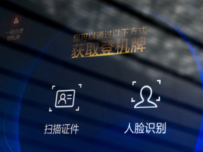 I played around with the automated check-in kiosk anyway, and had my face scanned. The option on the right says "facial recognition" in Chinese.