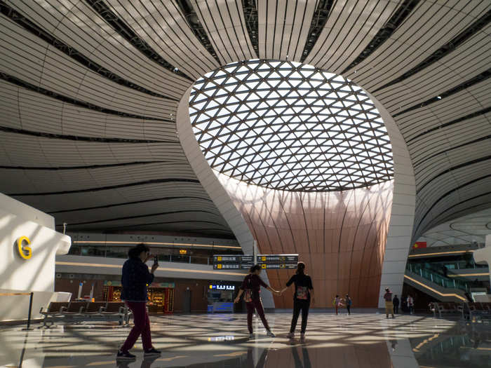 Time for check-in. I was stunned by the beauty of the departures hall — massive openings in the ceiling let natural sunlight flow in — reducing the need for artificial lighting — but blocked out heat.