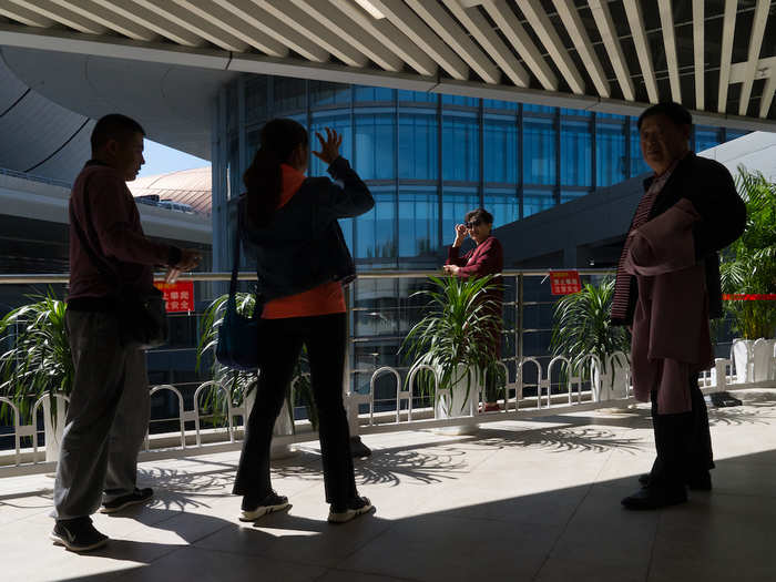 My first stop was the parking lot, which has plants dotted around the floor. I was surprised by how nice it was — as were the other travelers in this photo.