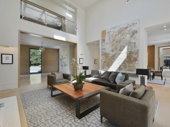 The interior of the three-level, 17,686-square-foot main home was designed with warm wood and neutral tones throughout.