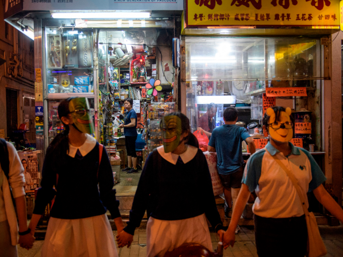 Masked protesters also formed a human chain around parts of the city Friday night.