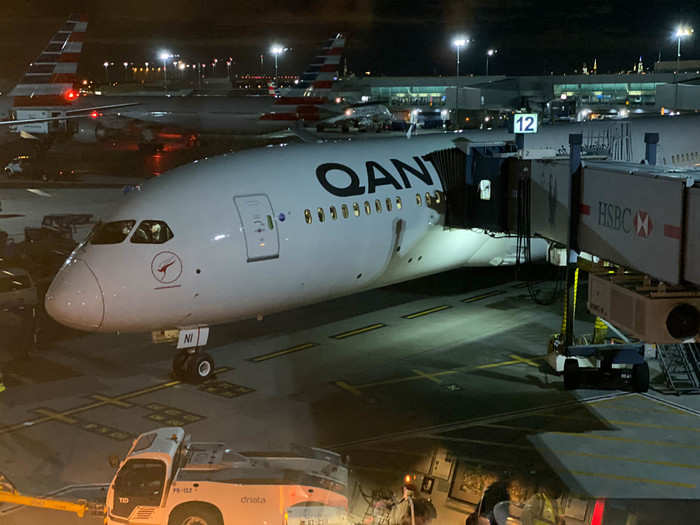 Soon enough, we went down to gate 12 and got a first glimpse of our home for the next day: a brand-new Boeing 787-9 airplane, registration VH-ZNI, delivered to Qantas from Boeing