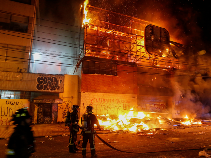 Authorities instated a nighttime curfew Saturday through the Santiago metro area in an effort to establish order in the city. The curfew was in place until 7 a.m. Sunday local time. It didn