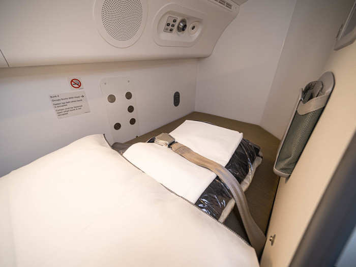 Each bunk on this flight had a pillow, a sheet, and a blanket, plus a personal air vent, like the ones you might find near a passenger seat.