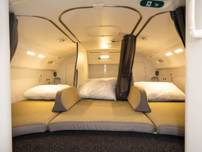 There are six narrow bunks in the cabin crew rest on Qantas