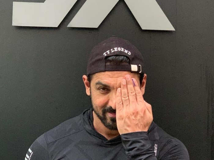 John Abraham took a picture of himself outside the gym after voting.