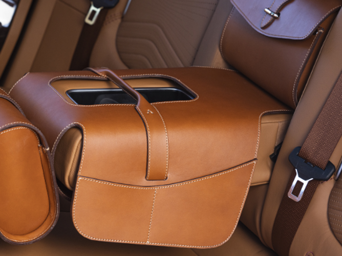 The Essentials Pack includes a center console organizer, a rear-seat entertainment holder, heated front cups, and a carpet mat for the trunk.