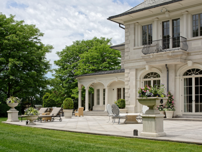 In the front and back of the home are more than 5,000 square feet of granite terraces.