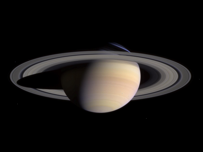 The new millennium brought new NASA missions like Cassini, which explored Saturn and its complex system of rings and moons. The probe beamed back this portrait as it approached the planet in May 2004.