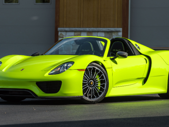 The 2015 Porsche 918 Spyder has a bold Acid Green paint job with an interior of black leather and suede, contrasted by the continuing Acid Green accents.