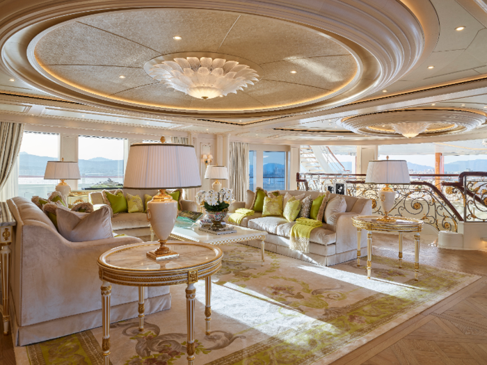 On the owners deck, the main salon features a leather-embossed ceiling dome with a glass chandelier of hand-blown leaves of glass.