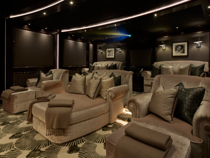 A soundproof art deco cinema on the lower deck is outfitted with several large armchairs.