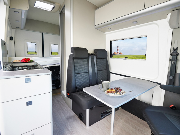 The driver and passenger seats can be rotated into a living and dining area.