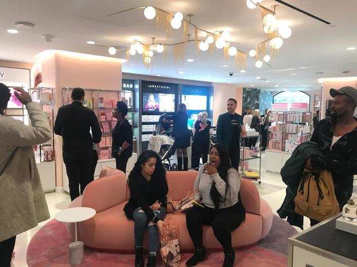 The beauty department was filled with unique light fixtures and plush millennial pink couches.