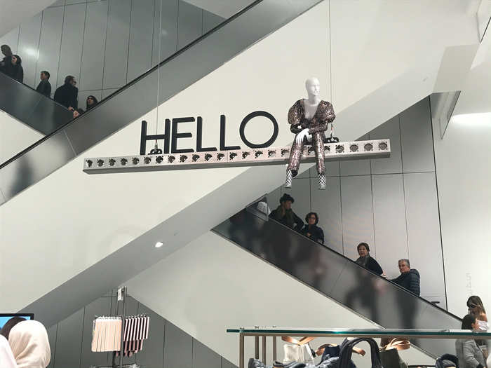 A mannequin in a bedazzled ensemble greeted me as I made my way past the escalator bank.