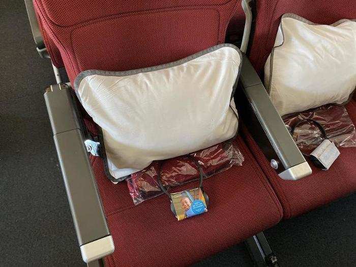 Each passenger got a pillow, a blanket, and a set of headphones to use for the flight.