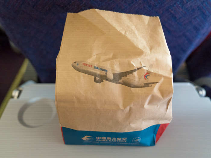 Soon after take-off we were given free food in a China Eastern Airlines paper bag. I was surprised we were given free food for a budget flight that was only two hours long.