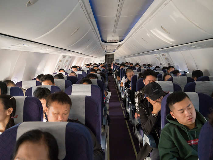 I got to fly on a medium-sized Boeing 737 plane, which had roughly 26 rows of six seats — three on each side of the aisle. It was almost completely full.