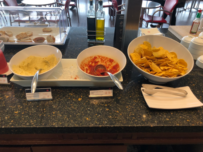 ... a selection of chips, salsa, hummus, and bread ...