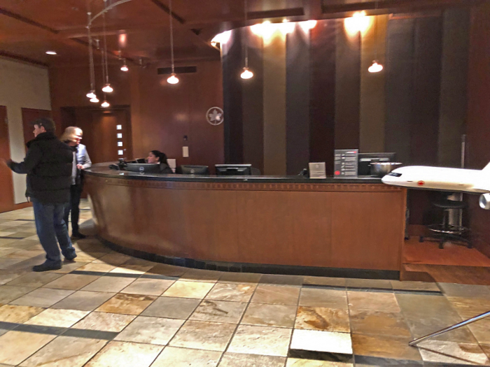 I arrived at 2:30 p.m. and the vast check-in area was pretty empty. It felt a bit odd to see only one person behind this giant desk.