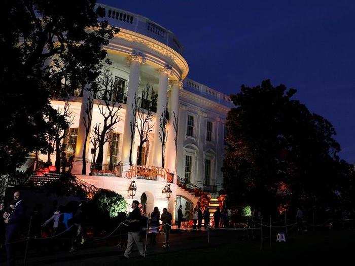 Soon, the sun set and the White House was illuminated in lights, emphasizing the Halloween decor.