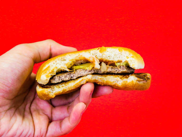 The addition of pickles and onions rounded out the burger with tart and sharp flavor notes, which thankfully made the combination of bun and beef more interesting and palatable.