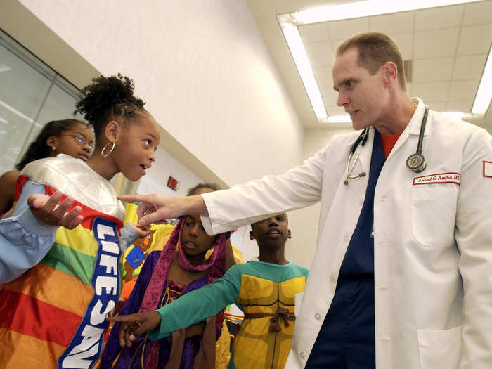 (2003) A Halloween safety demonstration at a Philadelphia hospital. The Lifesavers trick-or-treater wears a reflective panel for safety.