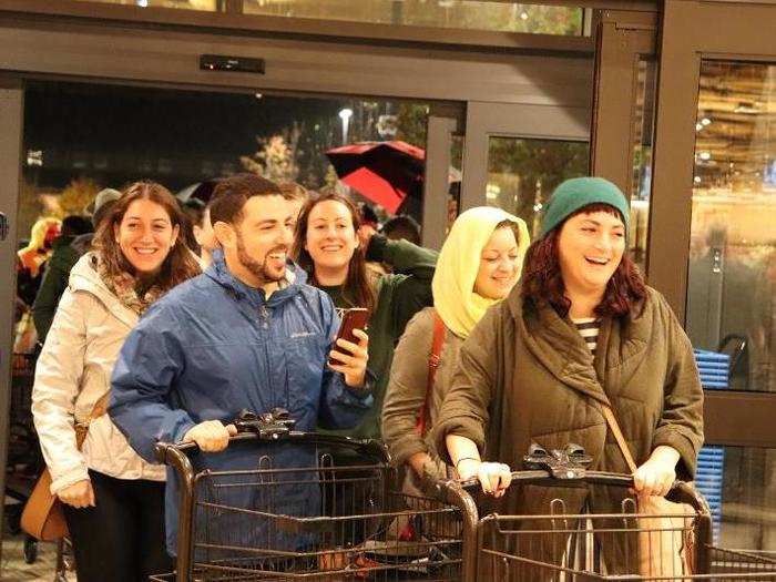 Some shoppers had waited multiple hours in the rain for this moment, and many employees applauded the customers as they entered.