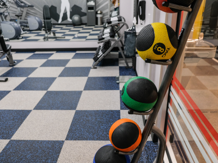 The gym was nothing luxurious, but it had the essentials: treadmills, stationary bikes, free weights, and medicine balls.