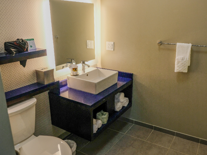 A mirrored sliding door separated the room for the bathroom.