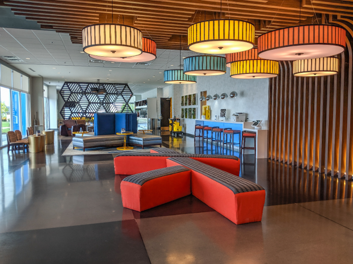 The lobby was colorful and brightly lit, with natural wood accents.