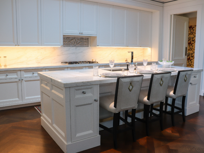 The kitchen comes with marble countertops, Miele appliances, a wine fridge, and two dishwashers.