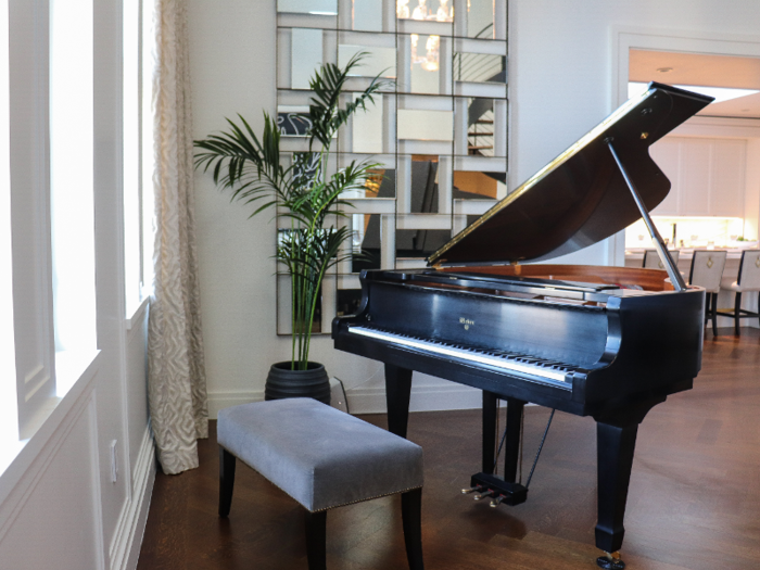 A grand piano occupies one corner of the great room.