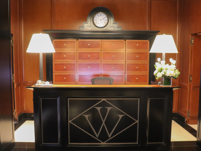 ... and a reception desk complete with the Woolworth "W," a motif throughout the building.