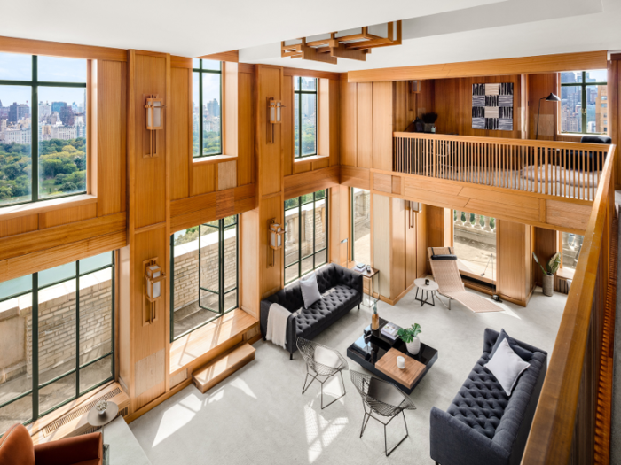 Double-height ceilings and large windows make for a light-filled great room.