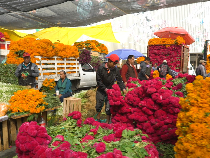 Cempasúchiles are placed on altars and tombstones.