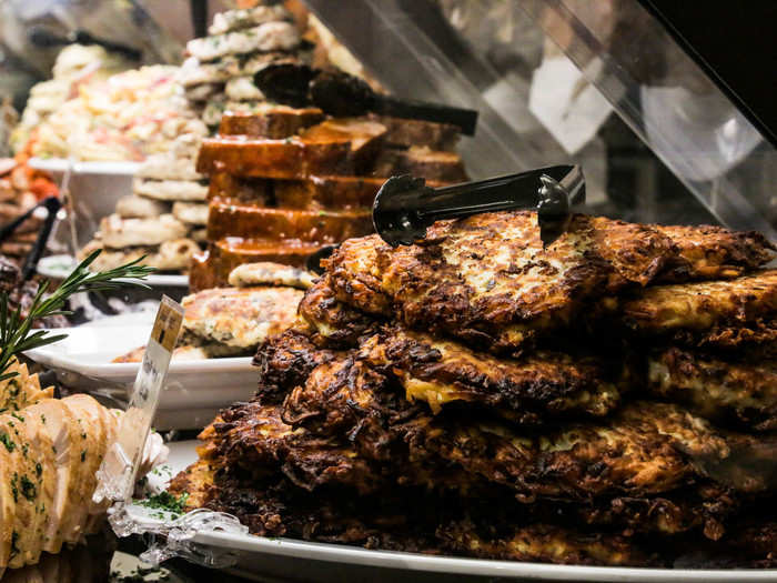 The deli case was piled high with delicious-looking food like latkes, rosemary lamb shanks, and sticky ribs.