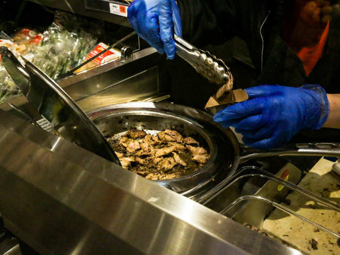 As we entered the prepared-foods section, I paused to sample some pork fresh off the stove. It was delicious. The employee who handed me the sample was very nice, like everyone at Wegmans.