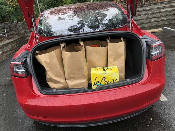 The Model 3 has plenty of trunk space — and an offbeat hatch design to enable that continuous glass roof.