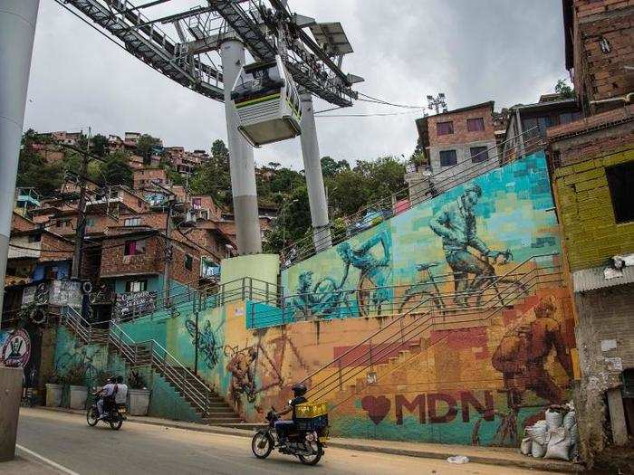 Now everyone can ride to the top and explore, something people from the city, from elsewhere in Colombia, and from abroad can be spotted doing. This is the neighborhood of Santo Domingo, at the top of Line K.