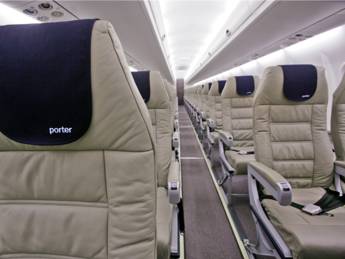 All the seats on my Porter plane were the same. They had this tan leather with a navy blue leather piece where passengers